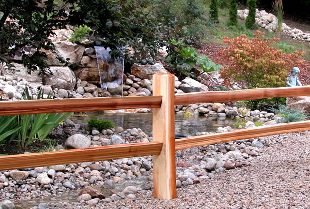 Image of a rail fence with horizontal rails and yellow pine that's very low maintenance