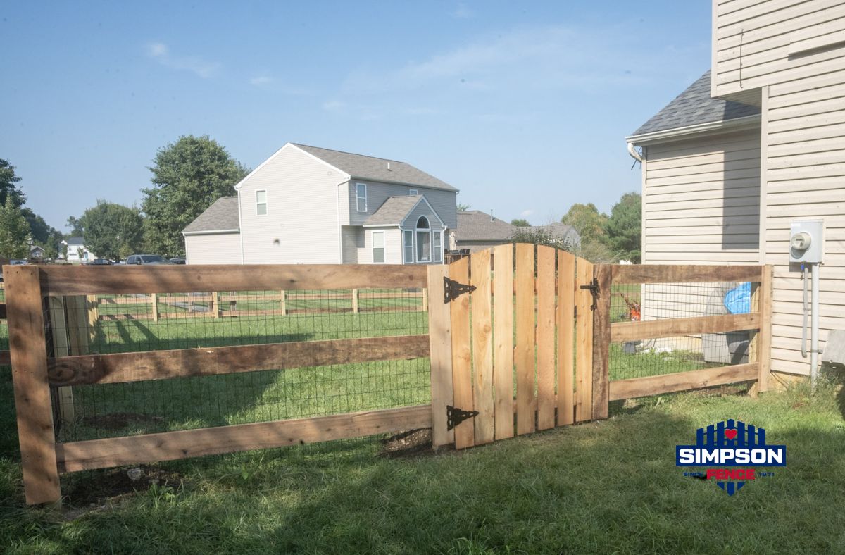 Kentucky Board Fence Installation in Middletown, Ohio 3 New 3-rail Kentucky Board fence with black welded wire, designed to help keep children and animals safely contained while matching the previous fence.