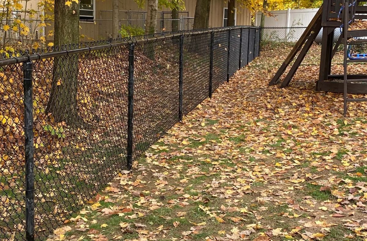 Chain-link fencing with protective coating designed to withstand harsh Ohio winters and the unique challenges of changing seasonal weather.