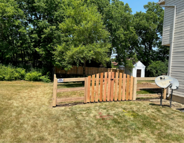 Kentucky Board Fence with in arched cedar double gate installed in Westchester, OH. Beautiful Residential Fencing Ideas 14