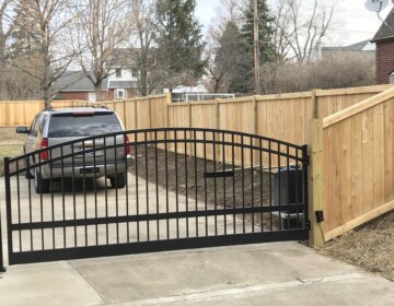 Arched Aluminum Entry Gate with Operator Aluminum gate with wood fencing